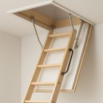 A wooden loft ladder extending from a ceiling hatch, showcasing a modern design for space-saving.